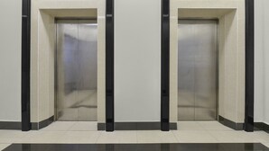 Two elevator doors in a hallway with a tiled floor. - Palette KL Sentral Station Formerly Scott Hotel (Kuala Lumpur)