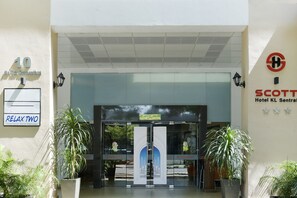 A hotel entrance with a sign for 'Relax Two Traditional Body Massage,' a 'Scott Hotel KL Sentral' sign, and a number '10' on the wall. - Palette KL Sentral Station Formerly Scott Hotel (Kuala Lumpur)