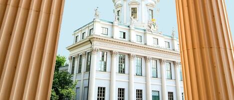 A classical building with a dome and columns.