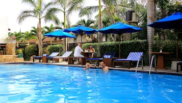 Outdoor pool, pool umbrellas, sun loungers