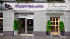 A hotel entrance with a sign reading "Kracow Residence" and a "HOTEL" sign above the door. - Kracow Residence Hotel (Krakow)