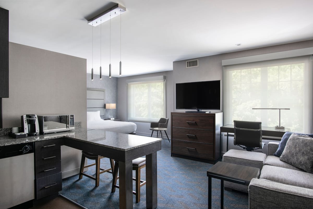 premium bedding, desk, laptop workspace, blackout curtains