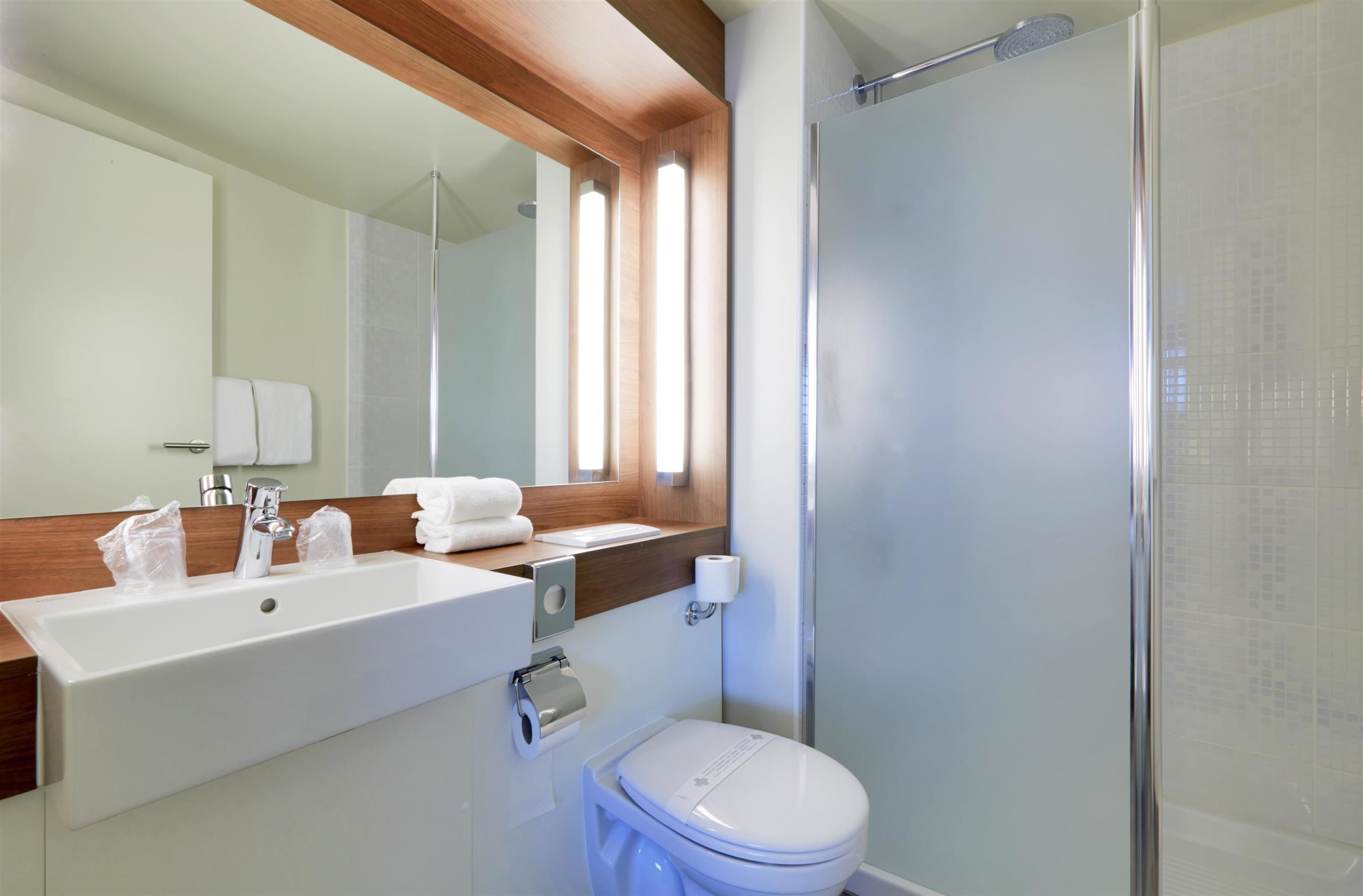 eco-friendly toiletries, hair dryer, towels