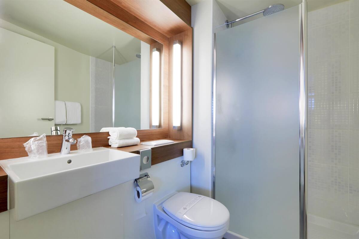 eco-friendly toiletries, hair dryer, towels