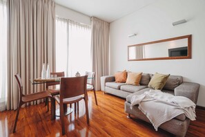 Deluxe Apartment, 1 Bedroom | Living area | 50-inch Smart TV with cable channels, TV - Time Select - Elegant Apartments (Santiago)