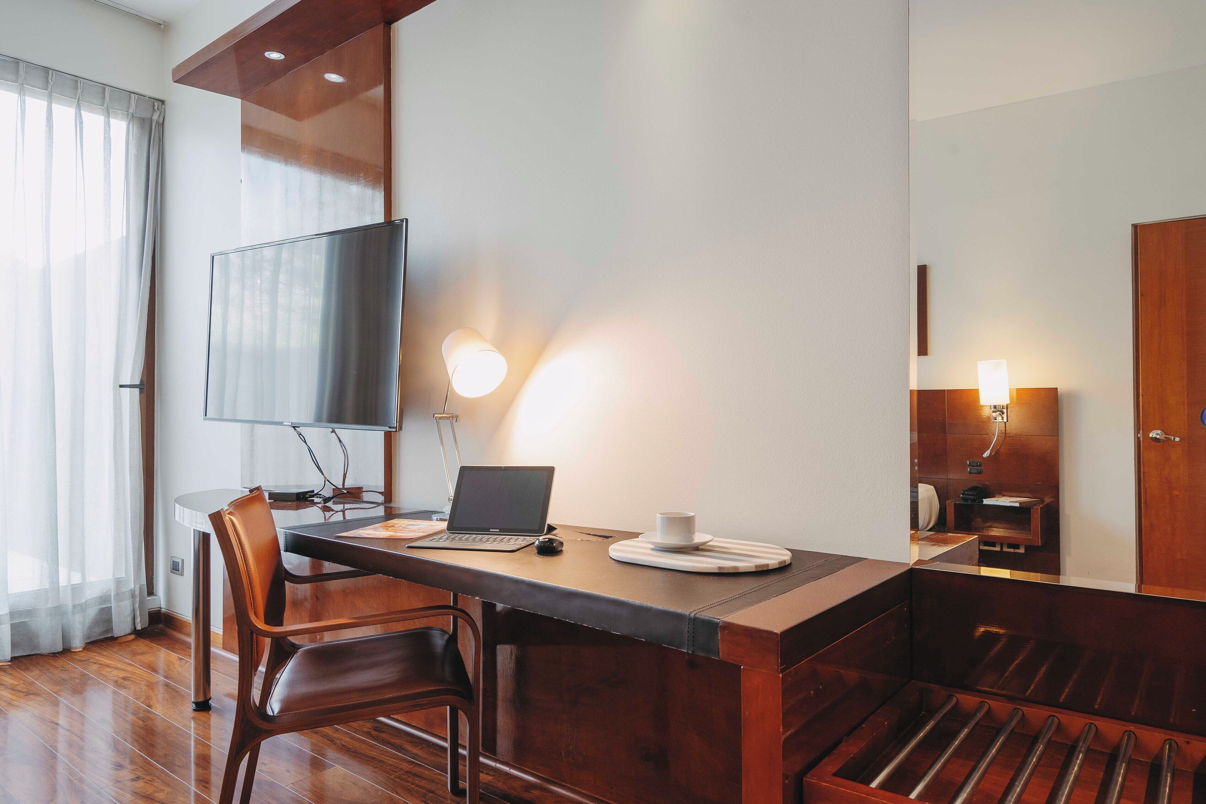 deluxe apartment, 1 bedroom | living area | 50-inch smart tv with cable channels, tv