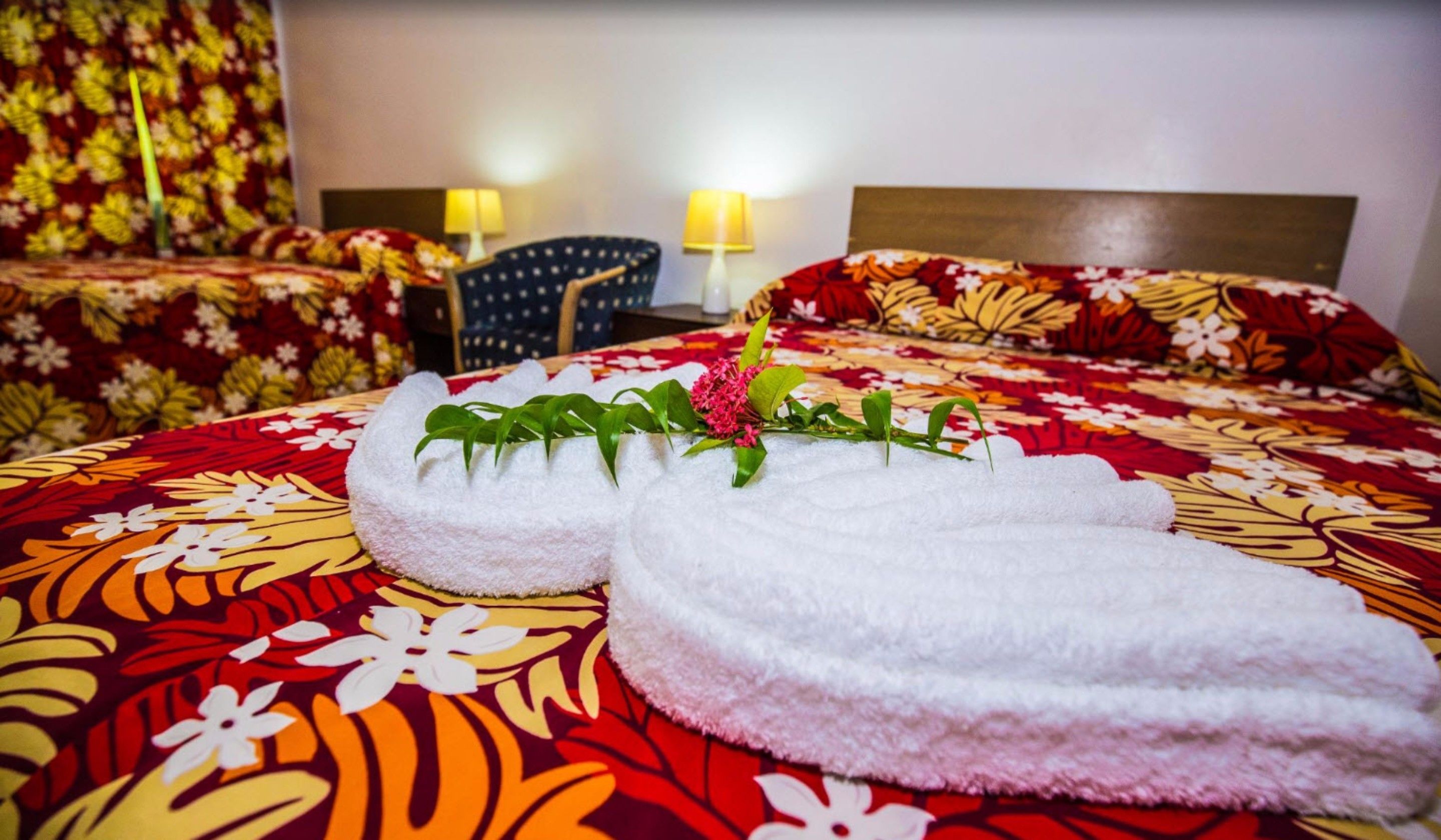 Desk, iron/ironing board, bed sheets