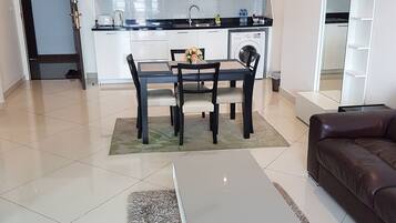 Premium Apartment, 2 Bedrooms, Non Smoking, Ocean View | Living area | 40-inch LCD TV with cable channels, TV