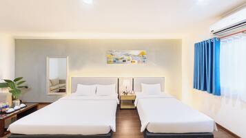 Grand Room, Air conditioning, City View | Minibar, in-room safe, iron/ironing board, free WiFi
