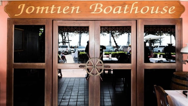 A wooden entrance with the name "Jomtien Boathouse" above it.