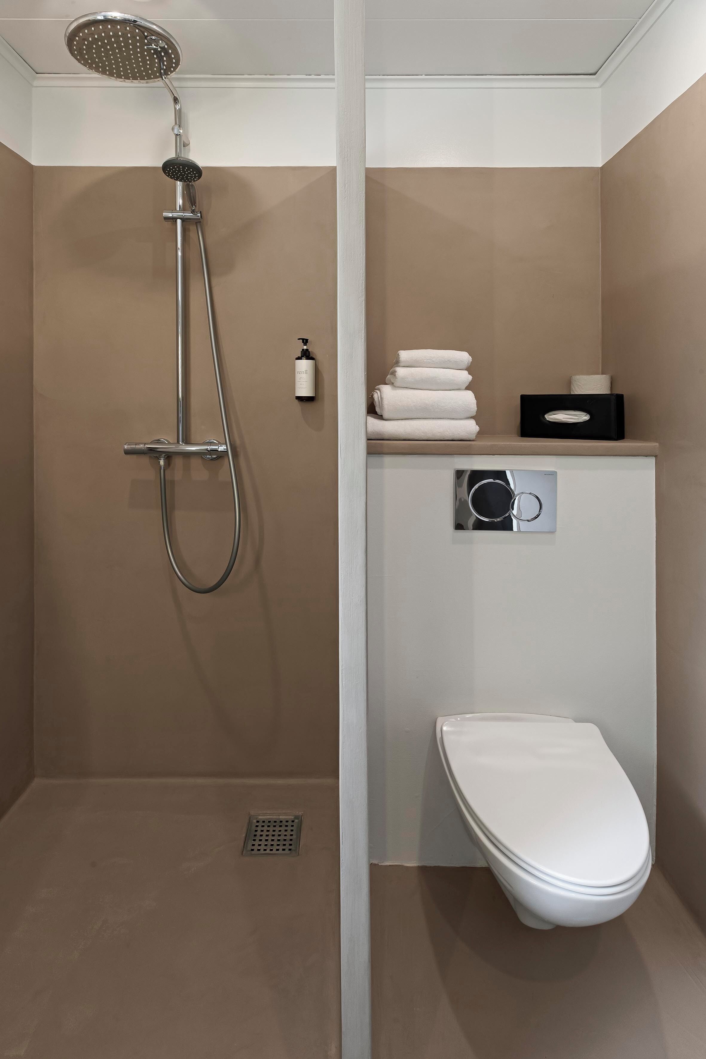 standard double room | bathroom | shower, hair dryer, towels