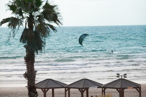 On the beach, sun loungers, beach towels