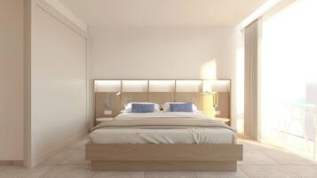 Junior suite, uitzicht op zee | Een minibar, een kluis op de kamer, een bureau, een laptopwerkplek