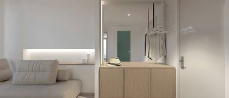 Un dormitorio moderno y minimalista con cama, mesita de noche y espejo.