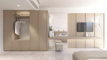 A modern bedroom with a built-in wardrobe, a flat-screen TV, and a bedside table with a vase and cups.