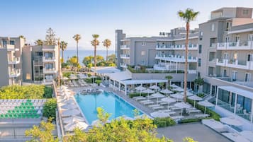 Outdoor pool, open 9:00 AM to 8:00 PM, pool umbrellas, pool loungers