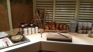 A breakfast buffet with pastries, bread, and condiments. - Hôtel Inn Design Moutiers (Moutiers)