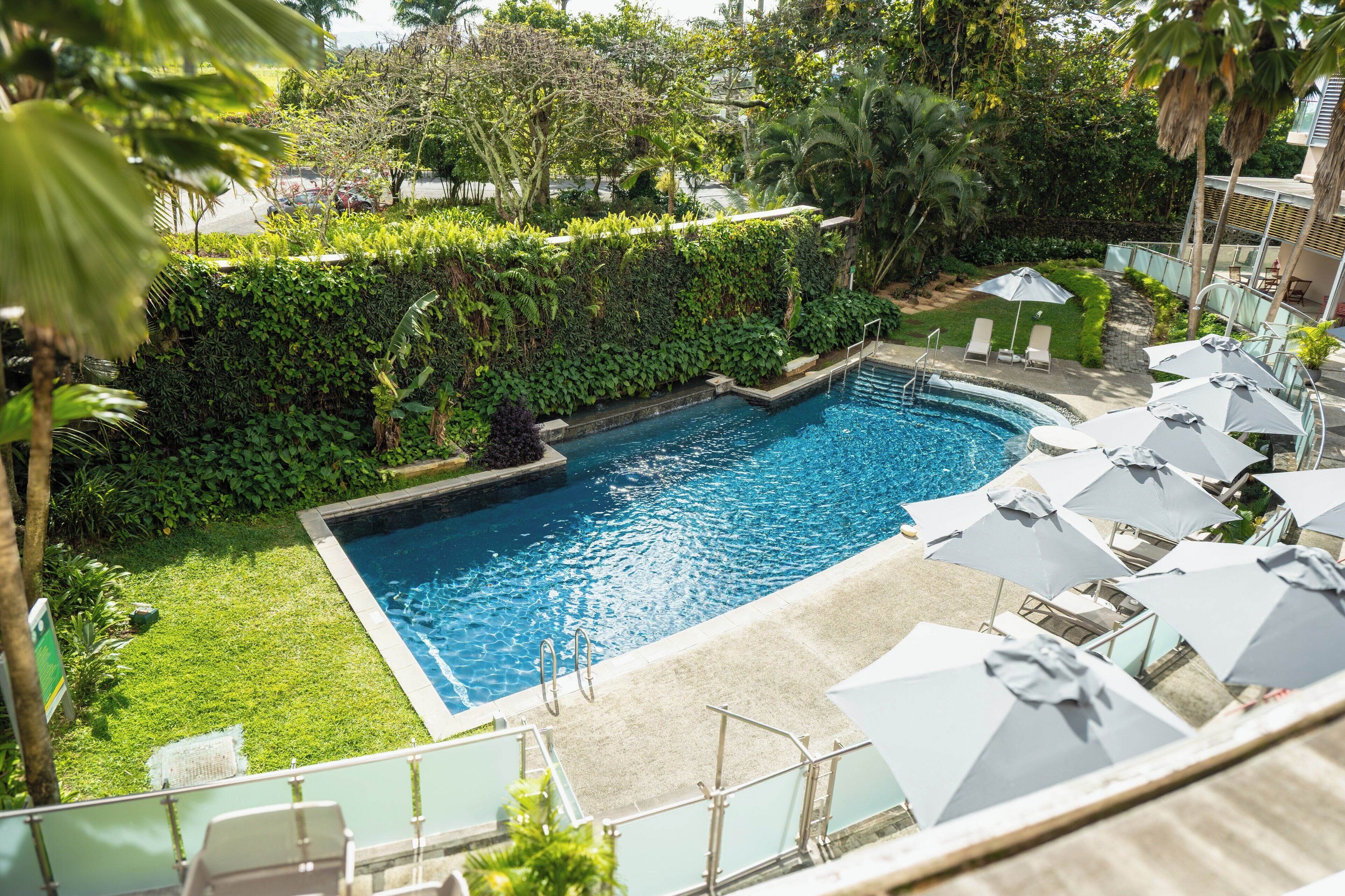 Outdoor pool, open 8:00 AM to 8:00 PM, pool umbrellas, sun loungers