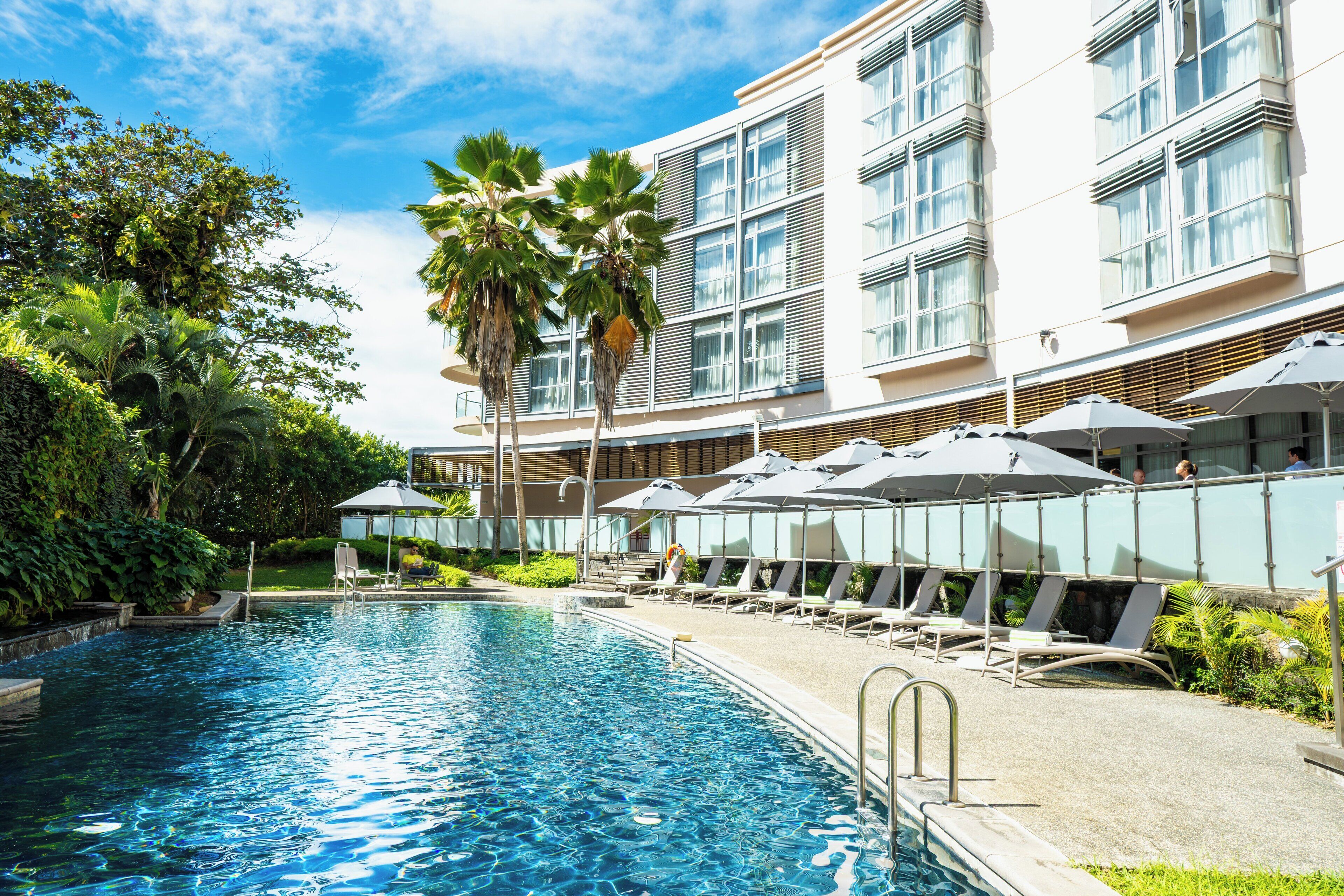 Outdoor pool, open 8:00 AM to 8:00 PM, pool umbrellas, sun loungers