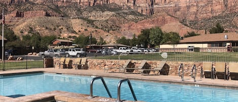 Seasonal outdoor pool, open 9 AM to 10 PM, pool loungers