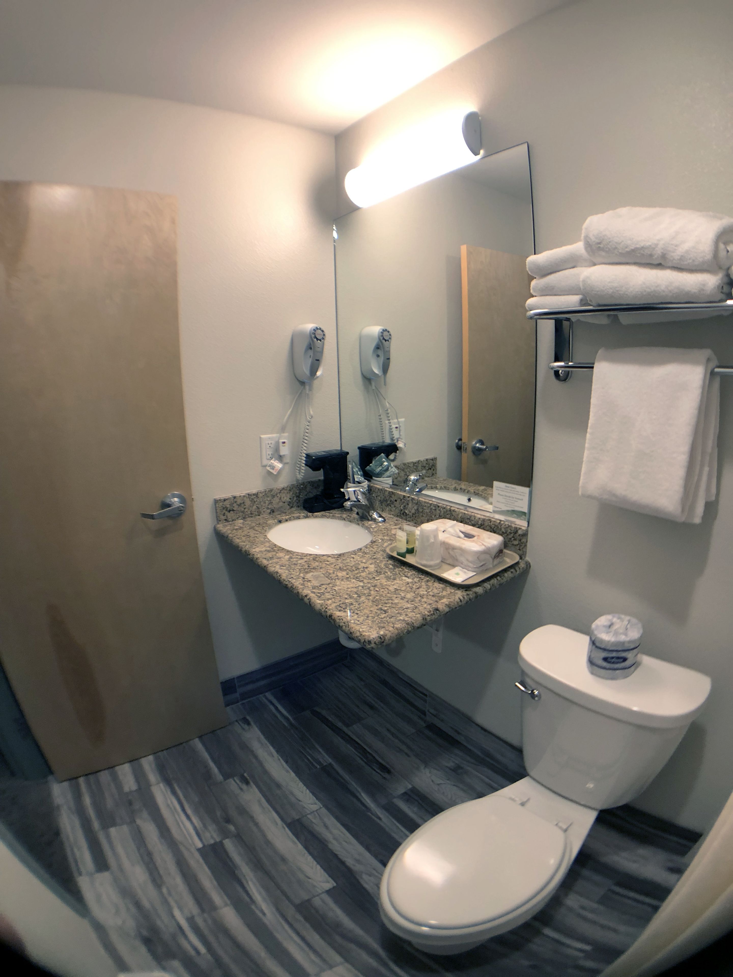 economy room, 1 queen bed (near ice machine) | bathroom | free toiletries, hair dryer, towels
