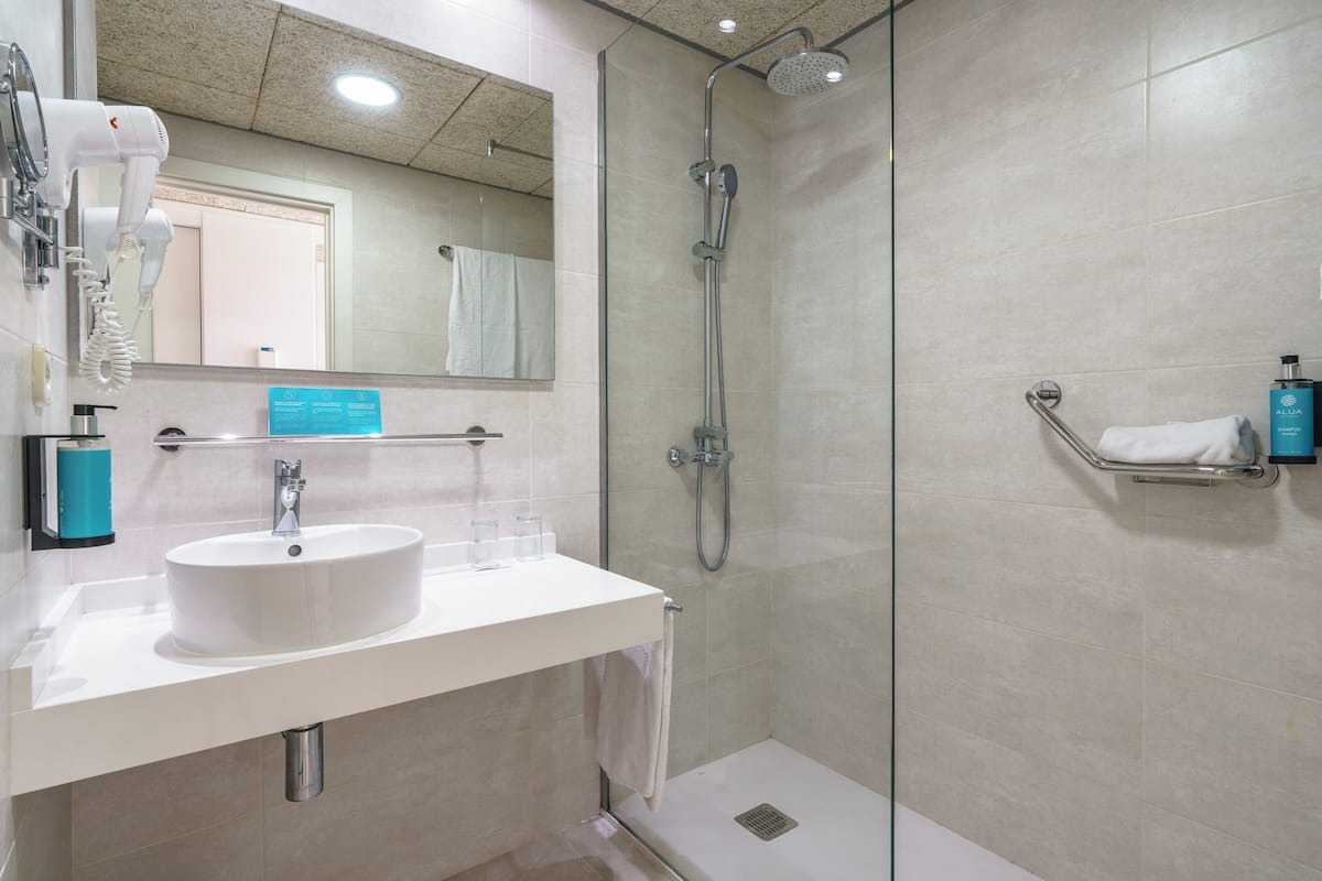 shower, eco-friendly toiletries, hair dryer, towels