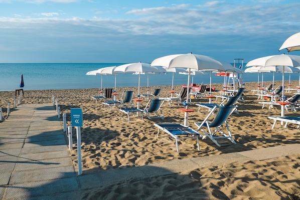 Private beach, sun-loungers, beach umbrellas, beach bar