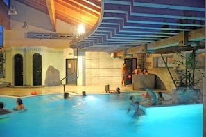 Indoor pool, seasonal outdoor pool, pool umbrellas, pool loungers