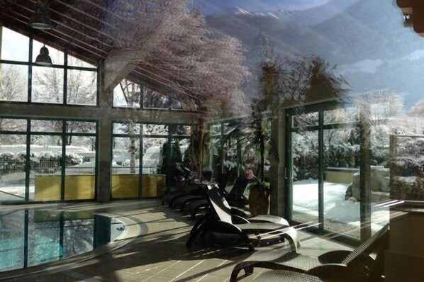 Indoor pool, seasonal outdoor pool, pool umbrellas, pool loungers