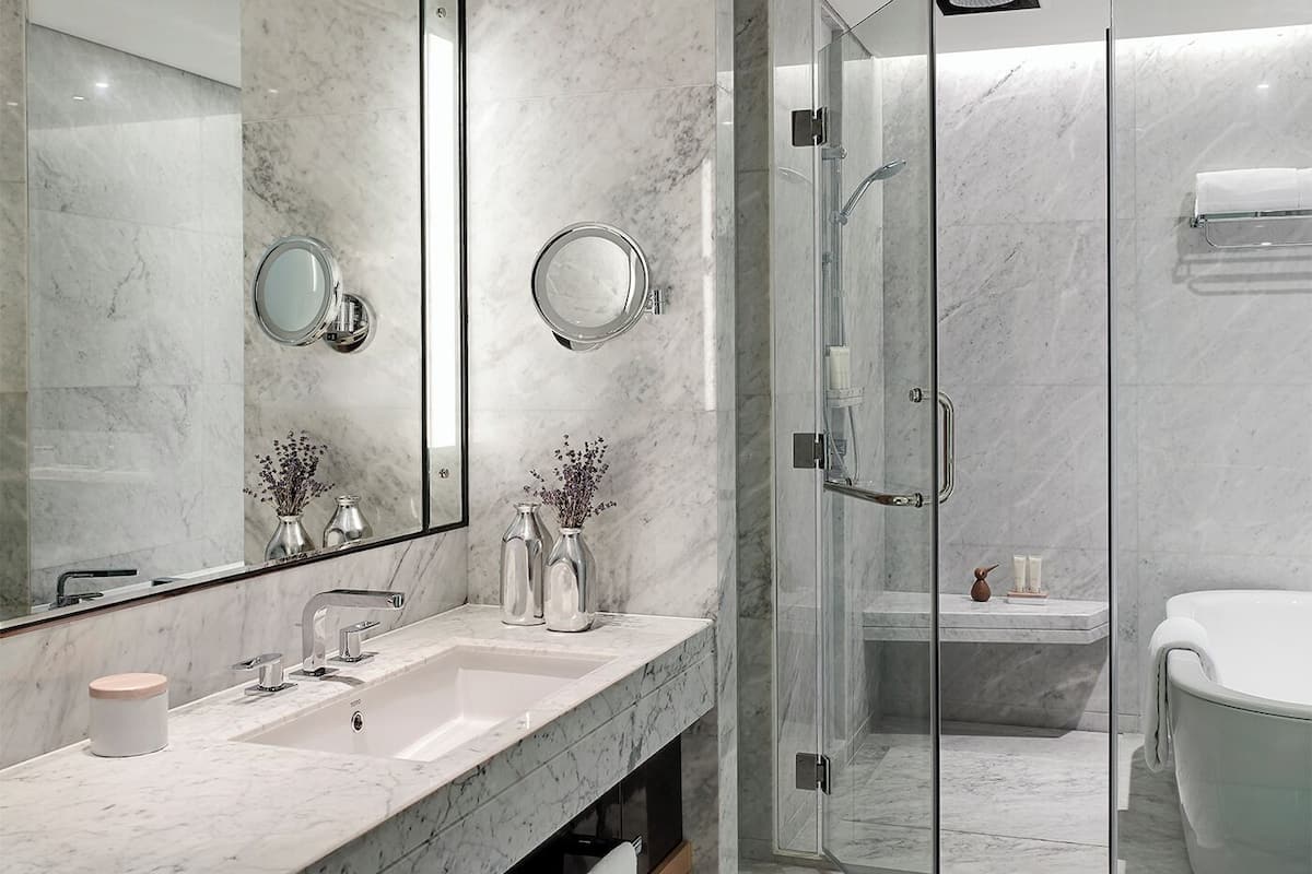 separate bathtub and shower, deep-soaking bathtub, rainfall showerhead