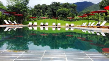 Outdoor pool, a natural pool, sun loungers