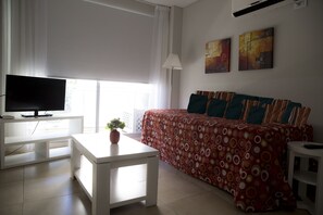 Family Apartment, 1 Bedroom | Living room | 32-inch TV with cable channels - Laprida Suites (Buenos Aires)
