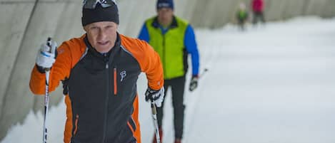 A person skiing in a tunnel.