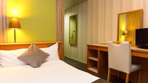 A hotel room with a bed, a desk, a chair, a television, and a mirror. - Hotel AreaOne Fukuyama (Fukuyama)