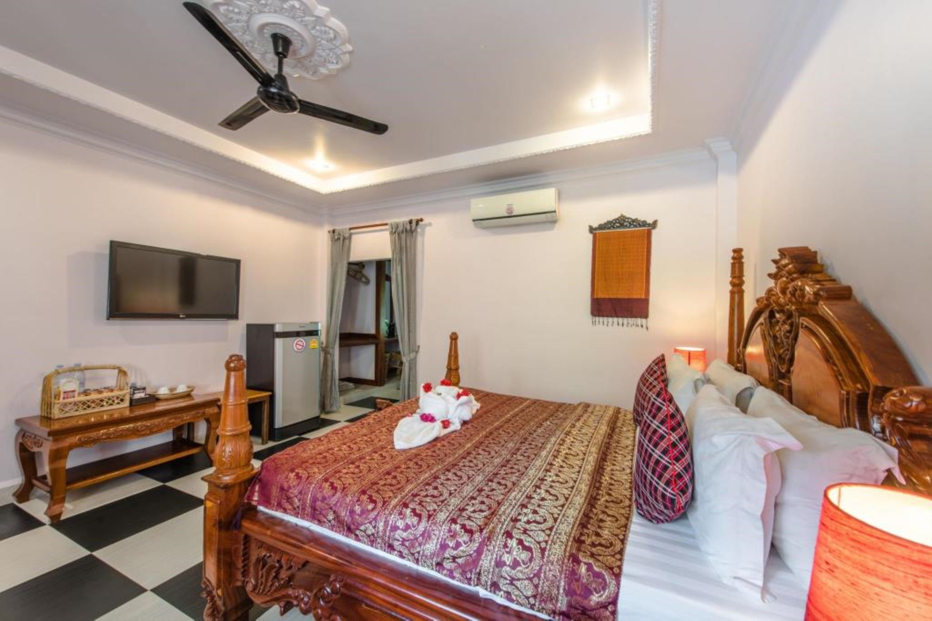 deluxe quadruple room | premium bedding, in-room safe, individually decorated