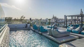 Seasonal outdoor pool, open 9:00 AM to 7:30 PM, pool loungers