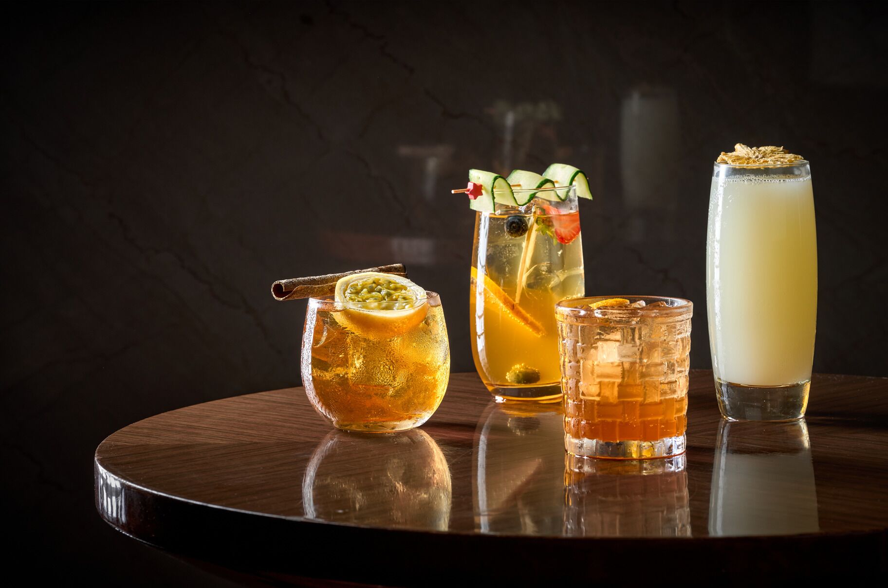 A selection of beverages on a reflective surface.