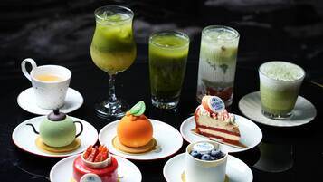 A variety of desserts and beverages on a table.