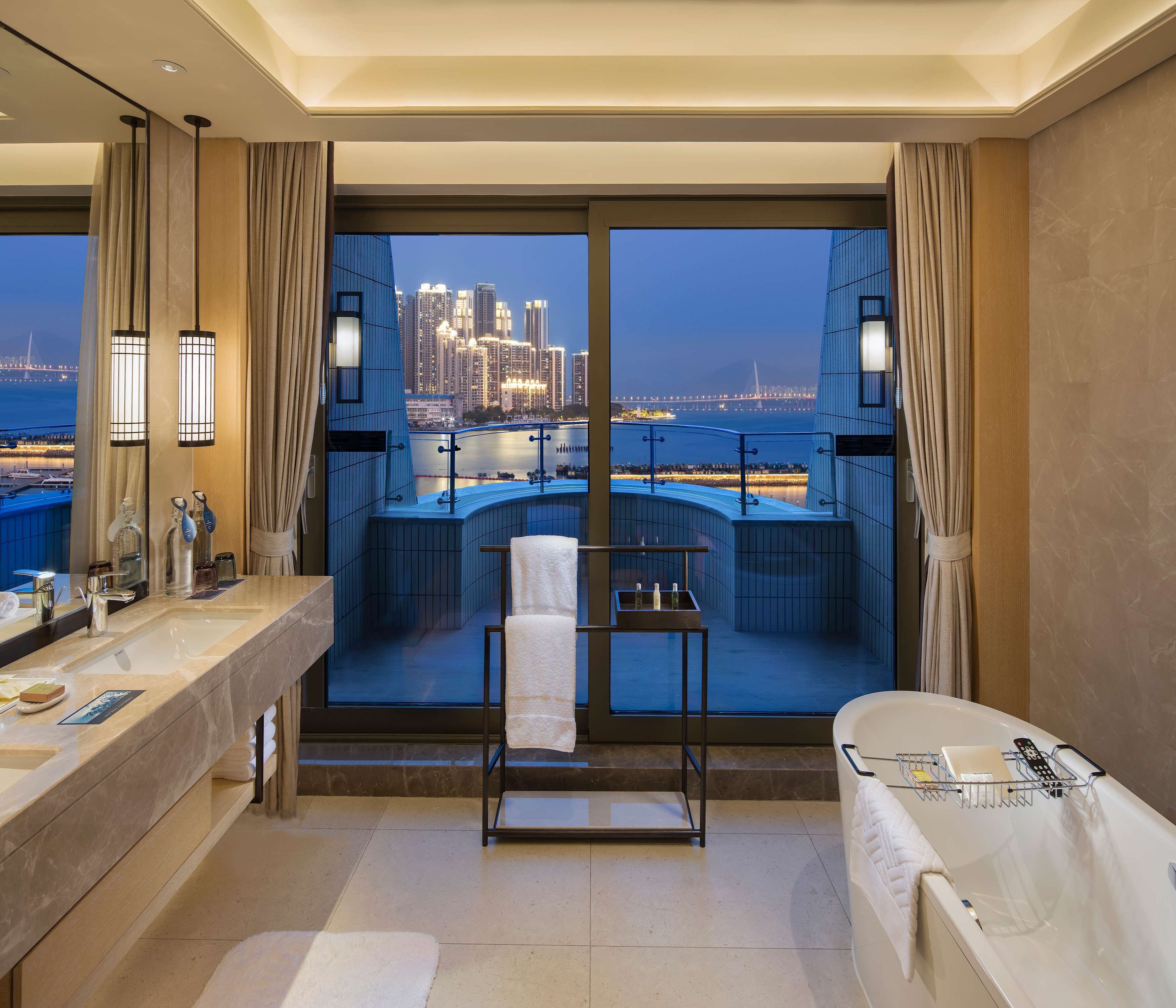 King One Bedroom Suite Nanhai Wing | Bathroom | Free toiletries, hair dryer, slippers, towels