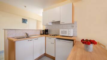 Superior Apartment, 1 Bedroom | Private kitchen | Fridge, microwave, stovetop, coffee/tea maker
