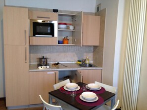 Fridge, microwave, stovetop, high chair