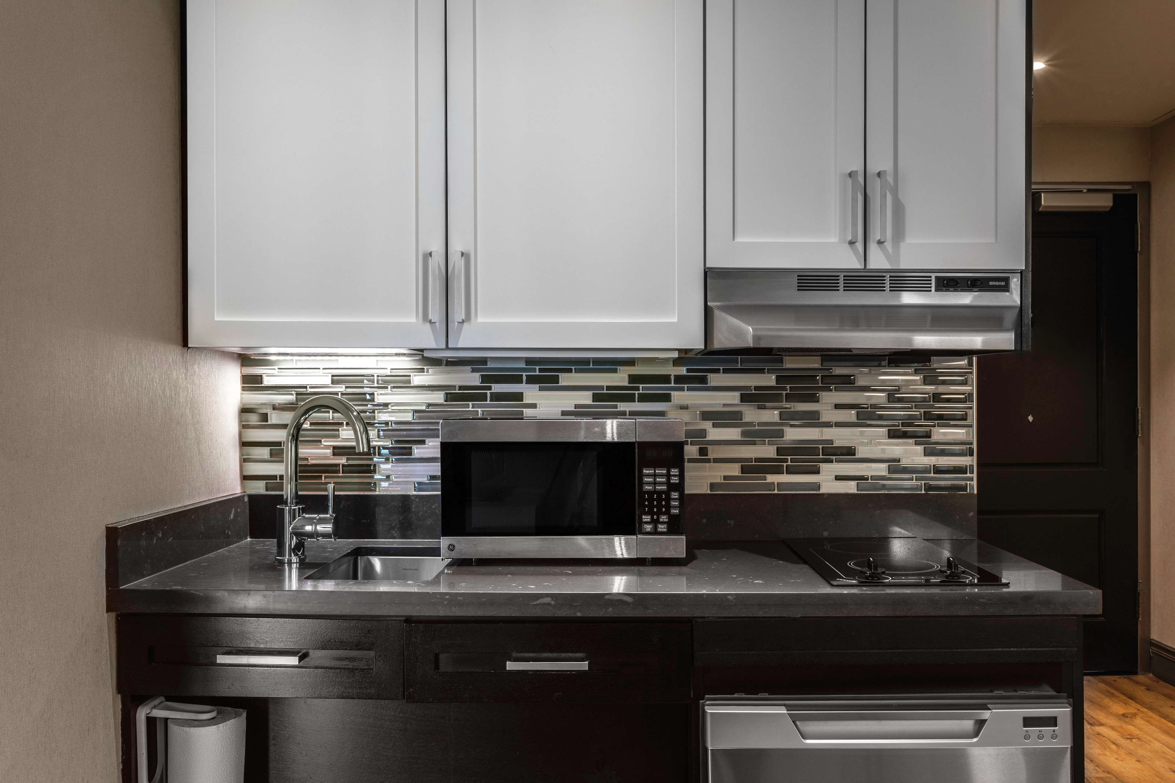 full-sized fridge, microwave, coffee/tea maker, cookware/dishes/utensils