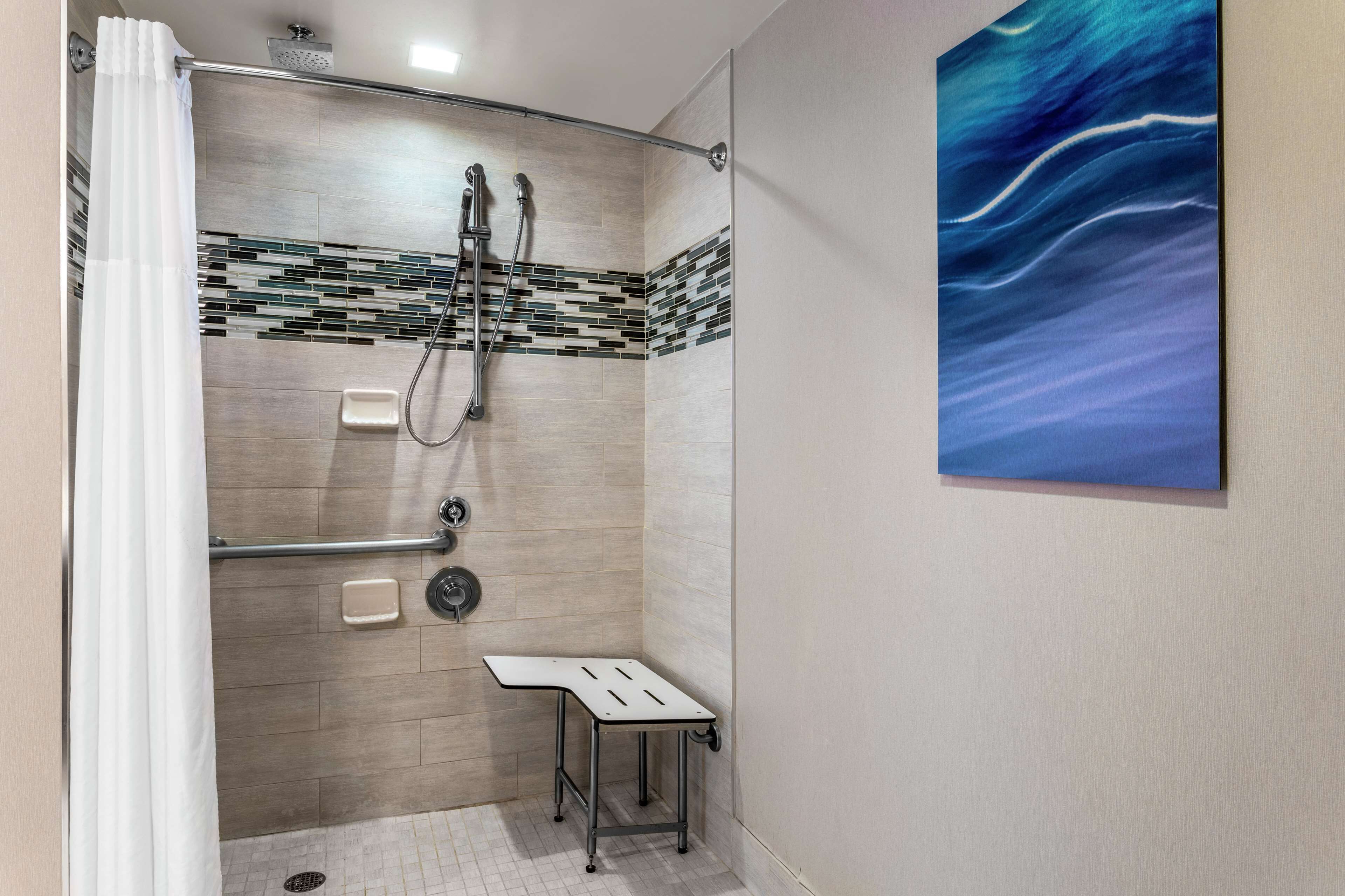 designer toiletries, hair dryer, towels