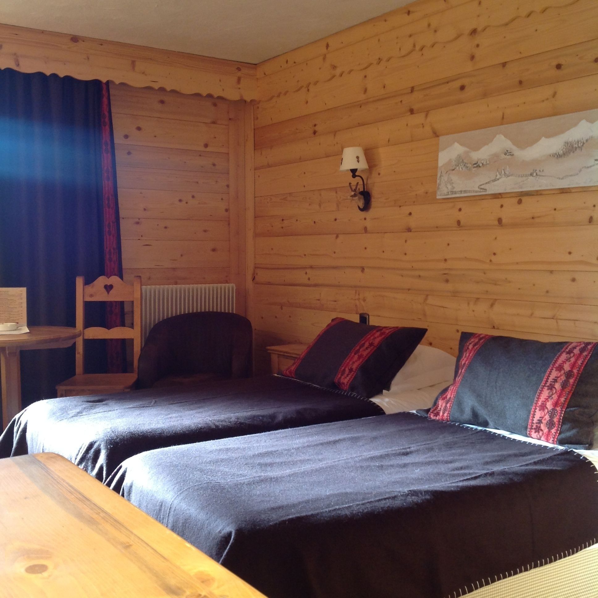 standard triple room west (village view) | in-room safe, individually decorated, blackout curtains, soundproofing