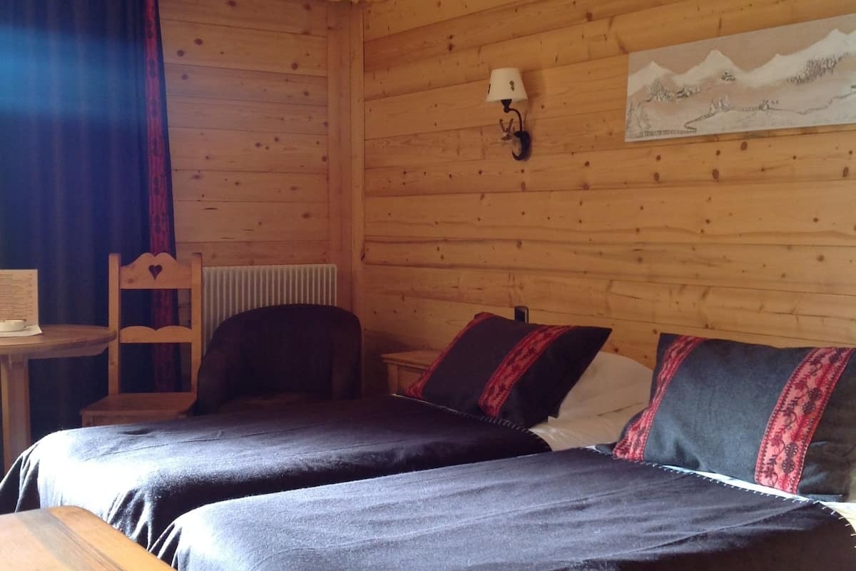 standard triple room west (village view) | in-room safe, individually decorated, blackout curtains, soundproofing