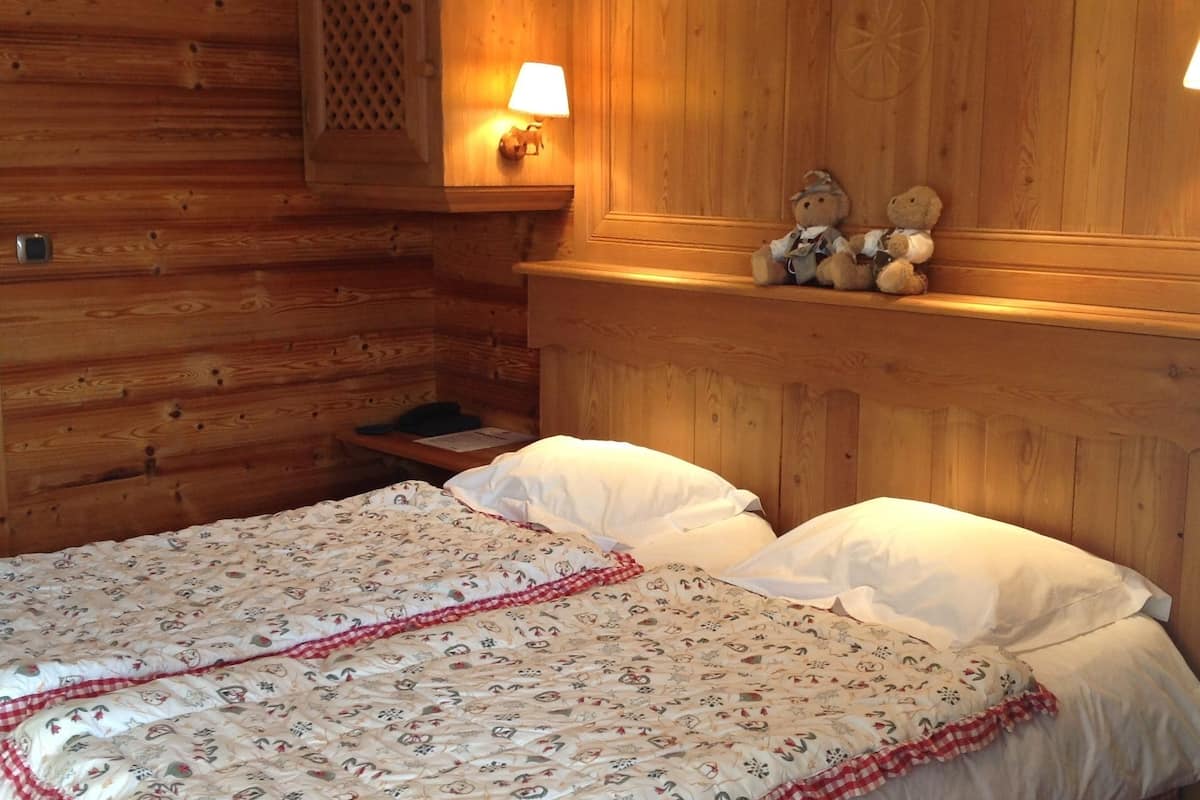 standard triple room west (village view) | in-room safe, individually decorated, blackout curtains, soundproofing