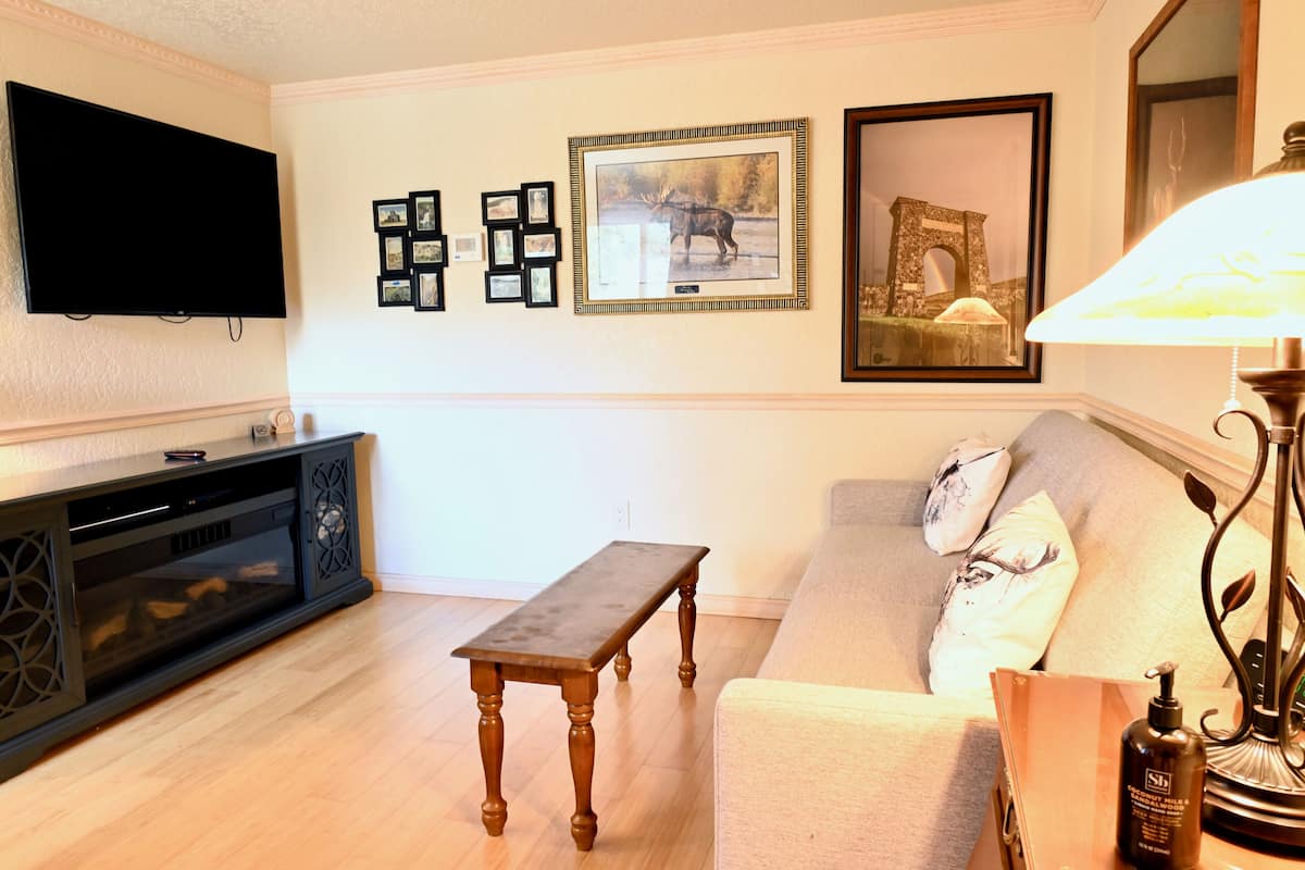 Suite | Living area | 65-inch Smart TV with satellite channels, TV, DVD player