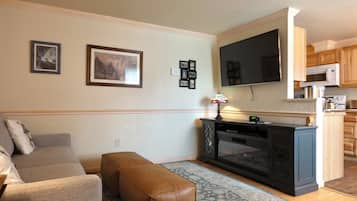 Suite | Living area | 65-inch Smart TV with satellite channels, TV, DVD player