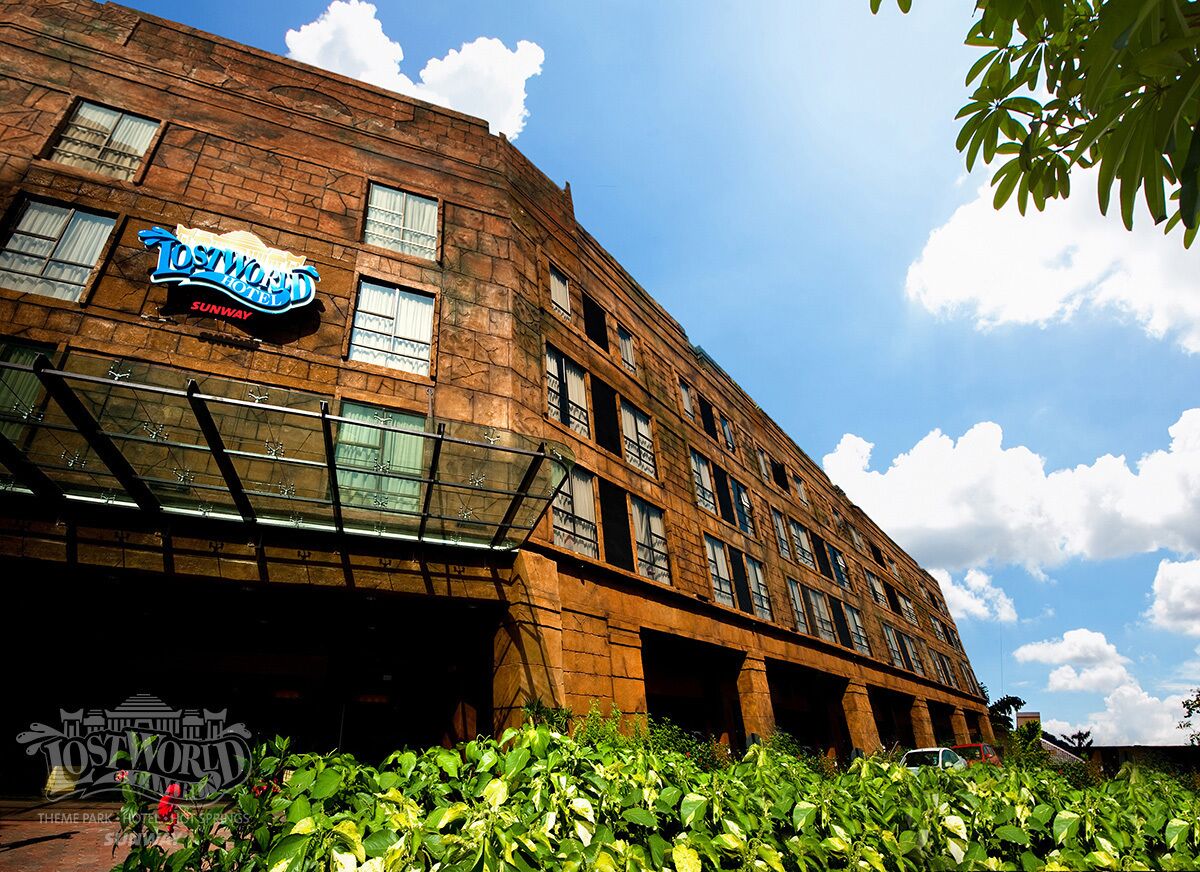 A brick building with a sign reading "Tostworld Hotel Sunway."