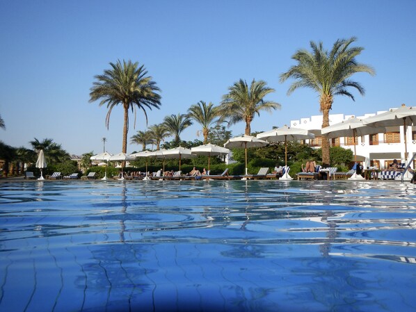 3 outdoor pools, open 7:00 AM to 7:00 PM, pool umbrellas, sun loungers